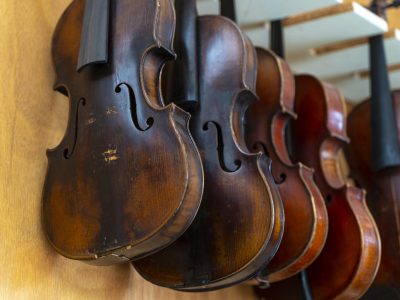 Old violins in the workshop of a string instrument luthier in Vienna (Austria). The Austrian capital has a great reputation for its luthiers' workshops for different string instruments.